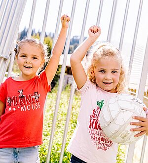 Two girls playing football